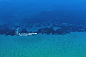 Aerial view of speed boat in motion. Water transportation and summer leisure time activity