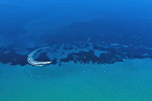 Aerial view of speed boat in motion. Water transportation and summer leisure time activity