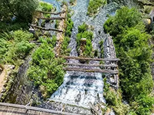 Aerial view of stone and wooden remains of old mills and wooden structures in Majerovo Vrilo in the village of Sinac