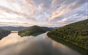 West Virginia Prints: An aerial view of Stonewall Jackson Lake and the dam in the distant foreground with clouds overhead at sunset