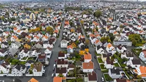 Industrial Area Prints: Aerial view of a suburban neighborhood with colorful houses and tree-lined streets