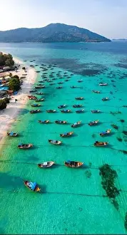 Sunrise Beach Prints: Aerial view of Sunrise beach with long tail boats in Koh Lipe, Satun, Thailand