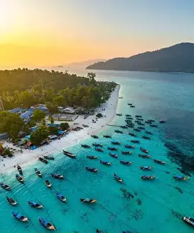 Sunrise Beach Prints: Aerial view of Sunrise beach with long tail boats in Koh Lipe, Satun, Thailand