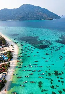 Sunrise Beach Prints: Aerial view of Sunrise beach with long tail boats in Koh Lipe, Satun, Thailand