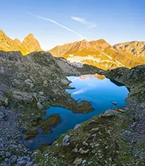 Montagna Prints: Aerial view at sunrise of the Pizzo Prevat reflected on Lago Leit