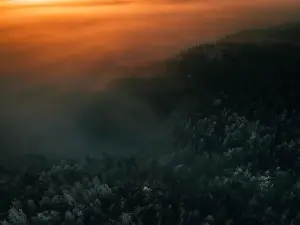 Snowstorm Prints: Aerial view of the sunrise over snow covered mountains near hohe wand in austria