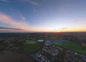 An aerial view at sunset over Rushmere near Ipswich, Suffolk, UK