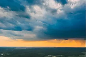 Sunray Prints: Aerial View. Sunset Sky Above Green Forest Landscape In Sunny Evening