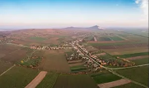 Mining Industry Prints: Aerial view of Szarsomlyo mountain with small village in Hungary