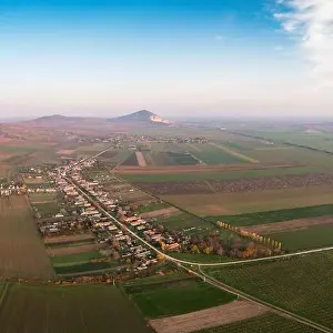Mining Industry Prints: Aerial view of Szarsomlyo mountain with small village in Hungary