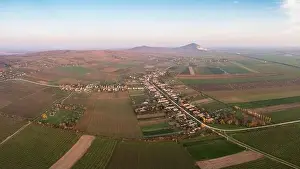 Mining Industry Prints: Aerial view of Szarsomlyo mountain with small village in Hungary