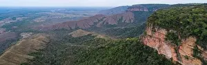 Aerial view of table mountains cliffs with foothills covered with rainforest