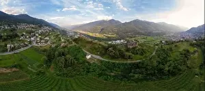 Aerial View - Terraced vineyards in the hills of Valtellina planted near monuments and old medieval ruins - Sondrio
