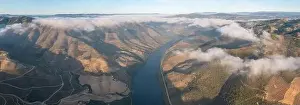 Aerial view of the terraced vineyards in romantic sunset in the Douro Valley near the village of Pinhao