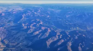 Panorama Mountain Prints: Aerial view of topographical Rocky Mountain landscapes on flight over Colorado and Utah during autumn