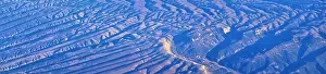 Panorama Mountain Prints: Aerial view of topographical Rocky Mountain landscapes on flight over Colorado and Utah during autumn