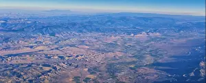 Valley Spring Prints: Aerial view of topographical Rocky Mountain landscapes on flight over Colorado and Utah during autumn