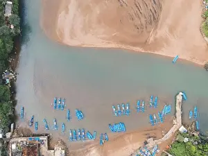 Baron Prints: Top aerial view of traditional boats in lagoon beach in Indonesia