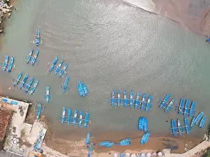Baron Prints: Top aerial view of traditional boats in lagoon beach in Indonesia