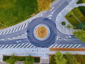 Top down aerial view of a traffic roundabout on a main road in a city in Bulgaria. High quality photo