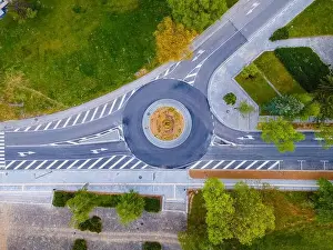 Crossroad Prints: Top down aerial view of a traffic roundabout on a main road in a city in Bulgaria