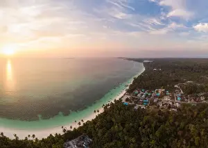 Aerial view tropical beach island reef caribbean sea dramatic sky at sunset sunrise