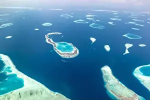 Aerial view on tropical islands. Aerial photo of beautiful paradise Maldives tropical beach on island. Summer and travel vacation concept