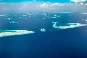 Aerial view on tropical islands. Aerial photo of beautiful paradise Maldives tropical beach on island. Summer and travel vacation concept