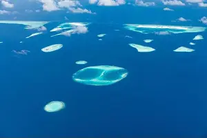 Aerial view on tropical islands. Aerial photo of beautiful paradise Maldives tropical beach on island. Summer and holiday and travel vacation