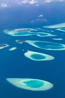 Aerial view on tropical islands. Aerial photo of beautiful paradise Maldives tropical beach on island. Summer and holiday and travel vacation