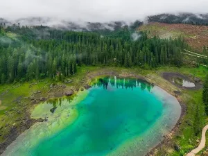 Val Di Fassa Prints: Aerial view of turquoise blue water of lake Carezza in Alps Dolomites