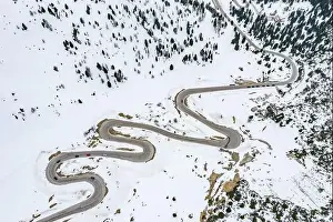 Aircraft Point Of View Prints: Aerial view of twisting road in the mountains of Italy