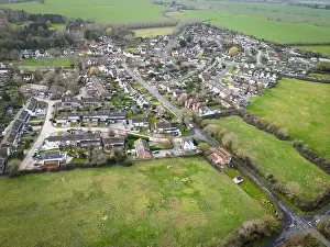 Aerial view of a typical English village showing housing development expansion over the years