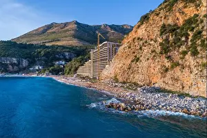 Unfinished Prints: Aerial view of the unfinished hotel in the village of Rezevici, on the coast of Montenegro