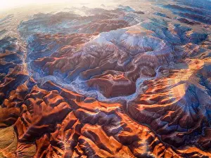Sky Landscape Prints: An aerial view of Utah Badlands in USA at sunset time