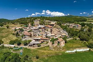 Low Clouds Prints: Aerial view of the village of Montcortès in summer (Pallars Sobirà)