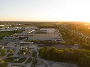 Unloading Prints: Aerial view of warehouse storages or industrial factory or logistics center from above