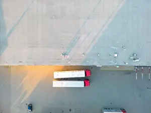 Aerial view of warehouse storages or industrial factory or logistics center from above