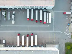 Aerial view of warehouse storages or industrial factory or logistics center from above