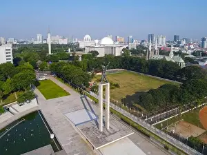 Symbol Tower Prints: Aerial view of West Irian Liberation monument in downtown Jakarta with Jakarta cityscape