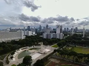 Liberation Prints: Aerial view of West Irian Liberation monument in downtown Jakarta and noise cloud with Jakarta cityscape