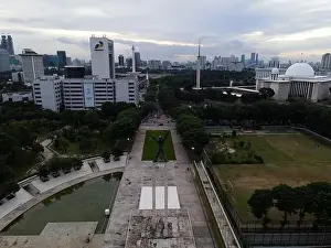 Symbol Tower Prints: Aerial view of West Irian Liberation monument in downtown Jakarta and noise cloud with Jakarta cityscape
