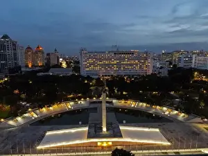Liberation Prints: Aerial view of West Irian Liberation monument in downtown Jakarta and noise cloud when sunset with Jakarta cityscape