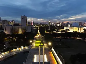 Liberation Prints: Aerial view of West Irian Liberation monument in downtown Jakarta and noise cloud when sunset with Jakarta cityscape