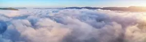 Aerial view white clouds in mountain and blue sky at morning. Top cloudscape view from drone