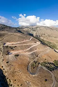 Bending Prints: Aerial view of the winding road to the town of Hora Skafion on the south coast of Crete