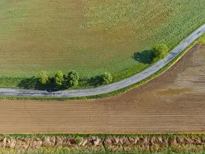 Aerial view of a winding stretch of road with trees and fields, Herencsény, Hungary