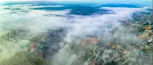 Barley Prints: Aerial view of the Xuan Tho suburbs near Da Lat city at morning with misty sky in Vietnam highlands