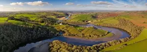 Paddocks Prints: Aerial vista by drone of the River Dart meandering through rolling countryside