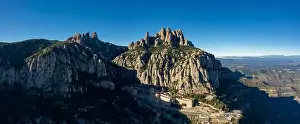 Aerial; wide panorama of famous abbey homonymous mountain range Montserrat; tourist attractions route of Spain; drone